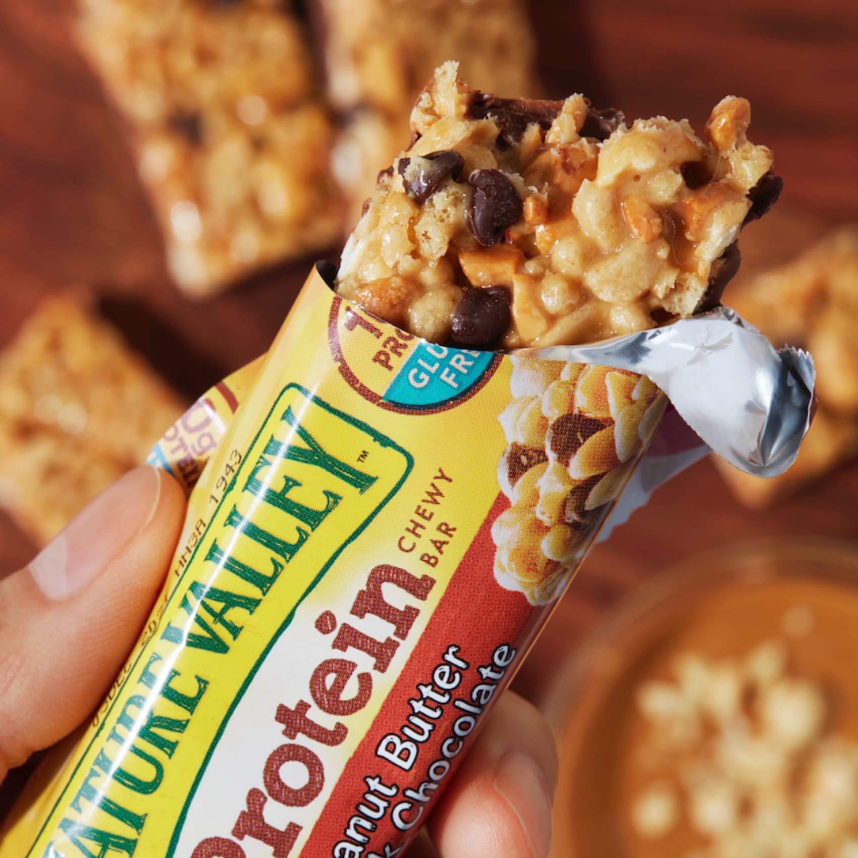 Nature Valley protein bar partially in wrapper